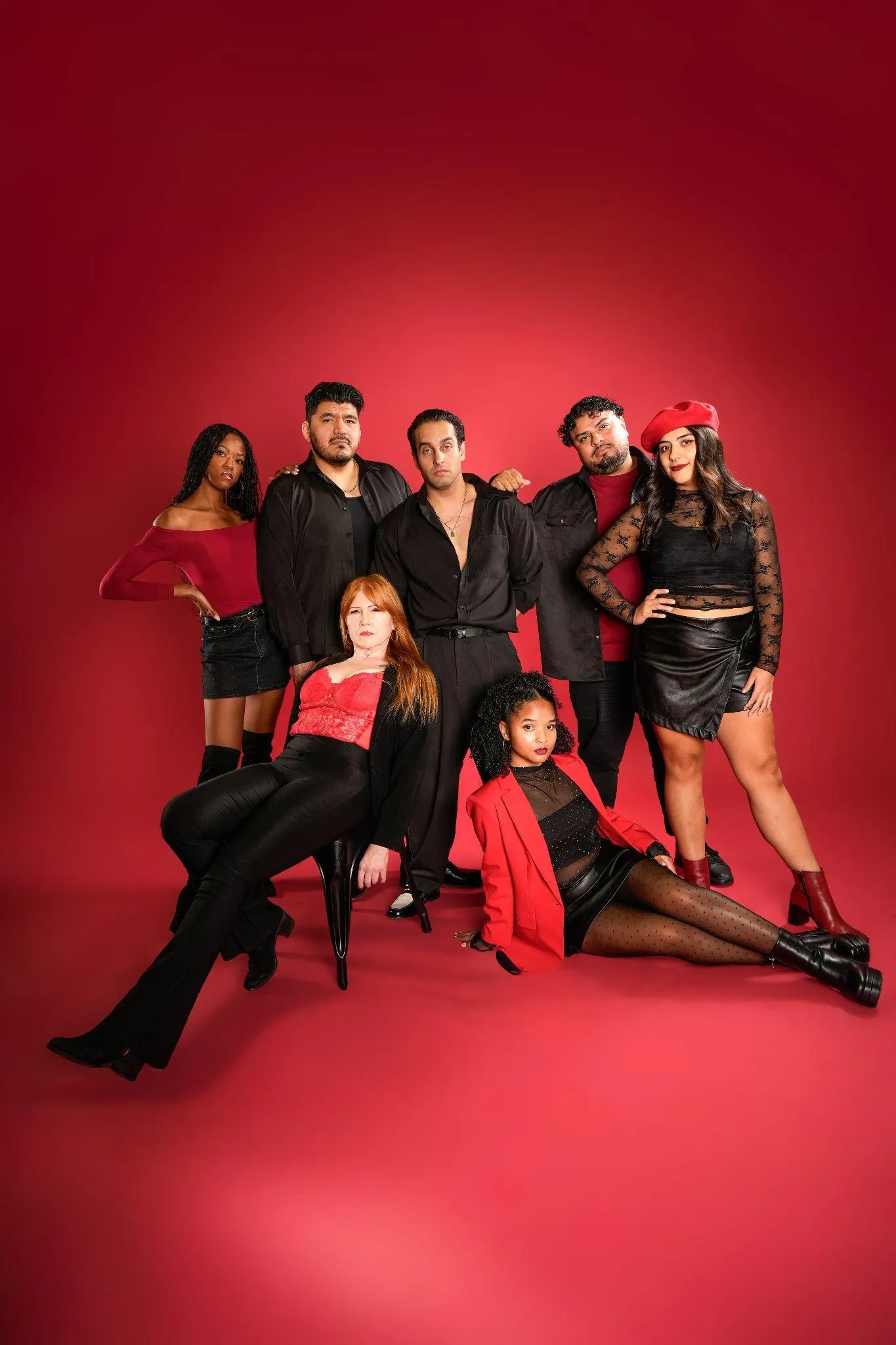 group-posing-stylishly-red-background
